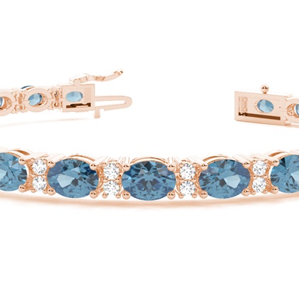 Ovales Tennisarmband mit blauem Topas in 4 Krappenfassungen