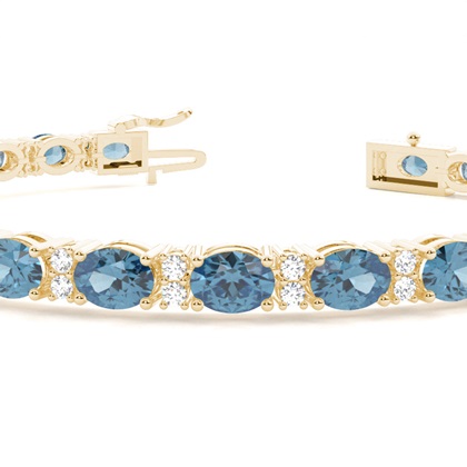 Ovales Tennisarmband mit blauem Topas in 4 Krappenfassungen