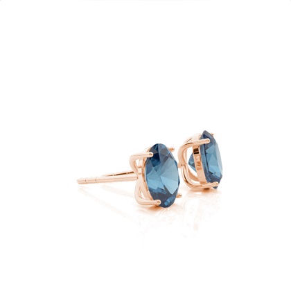 Ovale Blautopas-Ohrstecker in einer 4er Krappenfassung