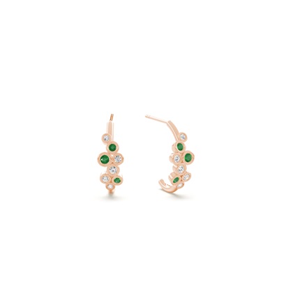 Emerald and round diamond bezel set half hoop earring