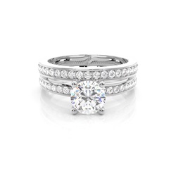 Diamant Verlobungsring in einer Krappenfassung mit passenden Ring