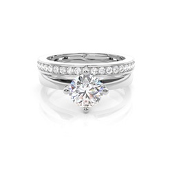 Diamant Verlobungsring in einer Krappenfassung mit passenden Ring