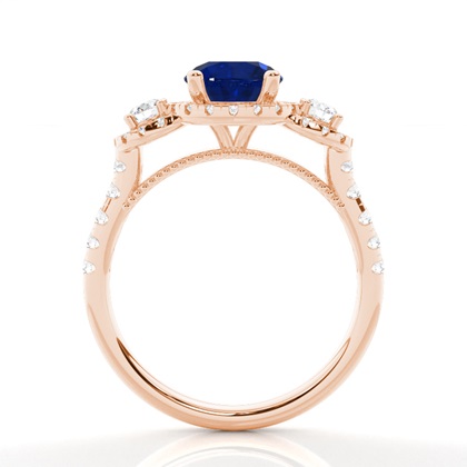 Zinkeneinstellung runder blauer Saphir-Drei-Stein-Ring