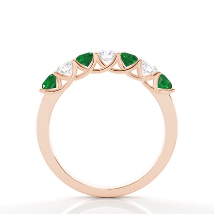 Zinkeneinstellung runder Smaragd halber Ewigkeitsring