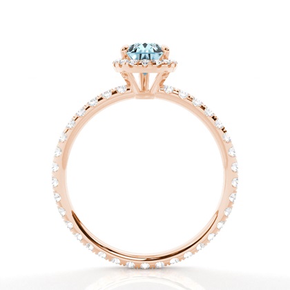 Tropfenförmiger Aquamarin Ring mit Seitensteinen in einer Krappenfassung