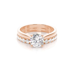 Diamant Verlobungsring in einer Krappenfassung mit passenden Ring