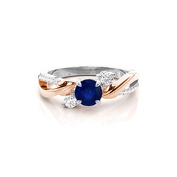 Runder Trilogie-Ring mit blauem Saphir in Krappenfassung